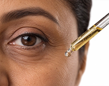 Indian woman receiving collagen skin treatment