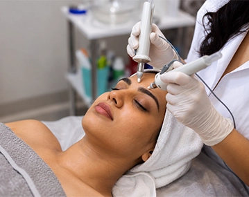 Indian woman receiving HydraFacial treatment