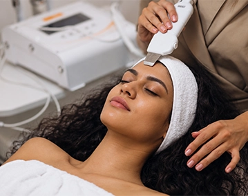 Indian woman receiving RF skin tightening treatment